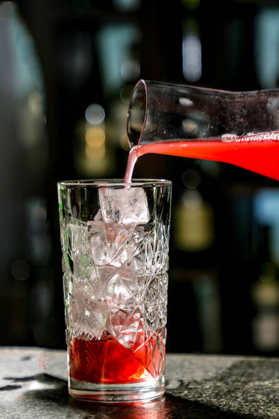 istock The bartender pours red juice or juice into a cocktail glass Cape Cod or Cape Codder 1182722069