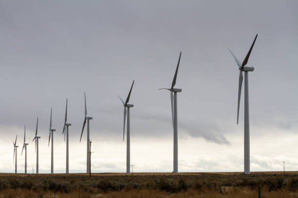 istock wind turbines making electricity against a cloud sky 1182722521