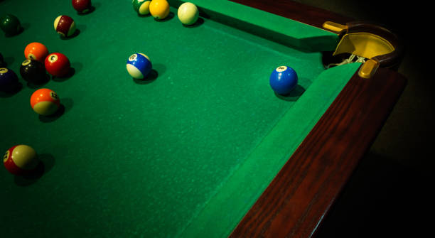 istock Group of numbered billiard balls on green table 1182723853