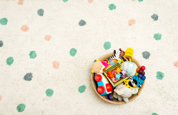 Top view on Colorful Baby Toys on a Carpet Background Toys in the floor with Copy Space for Text stock photo