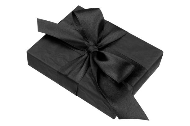 istock Gift box closeup isolated on white background. Elegant black gift box, present for Christmas holiday 1182729257