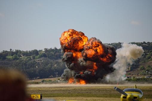Pyrotechnics from a World War Two bombing simulation run at the Camarillo airport in California during the air show.