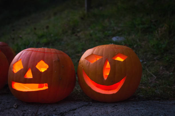 istock Illuminated Jack-O-Lantern family visiting the Black Forest 1182730908