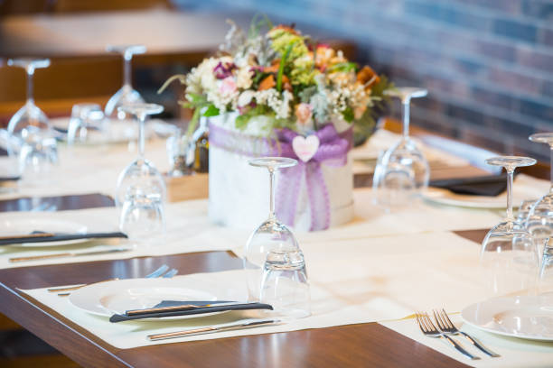 istock Luxury elegant table setting for dinner at a restaurant with flowers 1182731732