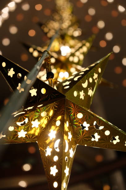 istock Decorative star-shaped lanterns suspended from the ceiling. Christmas garland. 1182732095