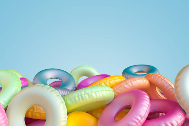 istock Inflatable circle on a multicolor blue pastel background. Summer vacation concept. Minimal abstract wallpaper concept. Velvet season. Flat lay. 3d render 1182734152