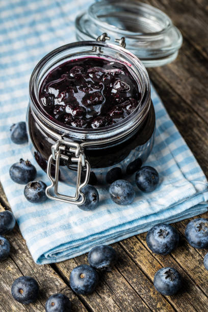 istock Sweet blueberry jam and blueberries. 1182734356