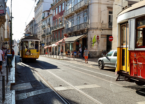 LISBON BAIRRO ALTO, PORTUGAL - AUG 04: Busy lifestyle in the old town of Lisbon with traditional tram , shops and urban life in Bairro Alto district, Lisbon Portugal on August 04, 2019