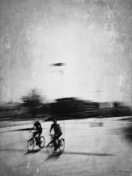 istock Monochrome view of two cyclists 1182736820