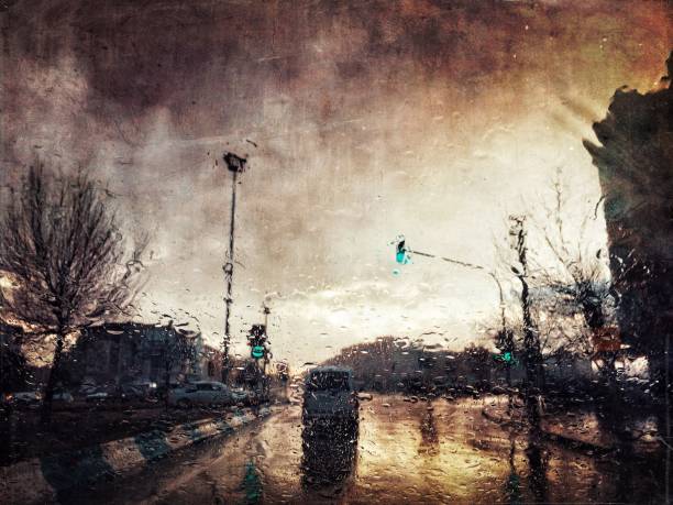 istock Urban road view behind raindrops 1182736847