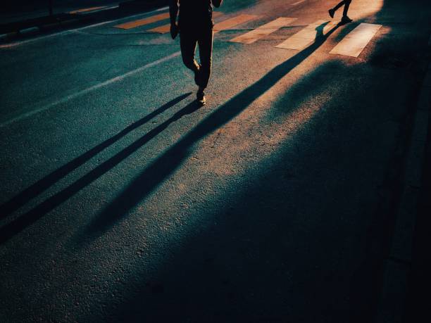 istock Two people walking on urban road 1182736879