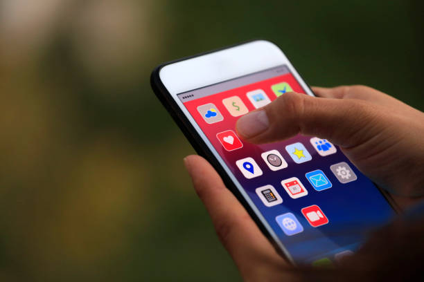 istock Social media icon on mobile screen, sharing and marketing 1182737013