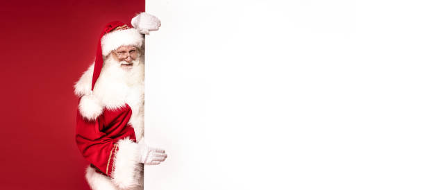 istock Real Santa Claus holding white empty board. 1182737842
