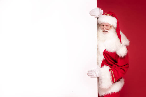 istock Real Santa Claus holding white empty board. 1182737863