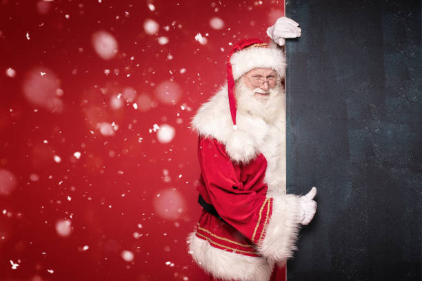 istock Real Santa Claus holding black empty board. 1182738051