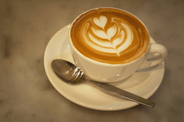 istock Beautiful served latte coffee in the cup 1182739760