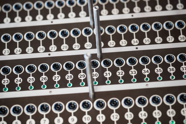 Close-up side view of sophisticated radio-controlled equipment with numbered panels and buttons located at a secret military base. Secret Technology Concept