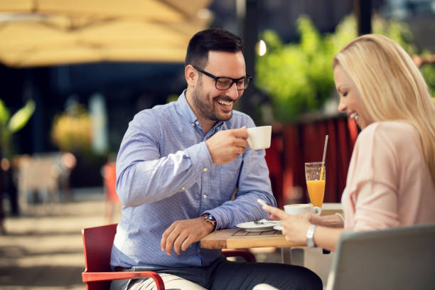 istock Happy couple having fun on coffee break in a cafe. 1182741237