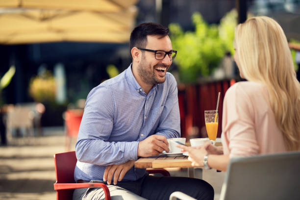 istock Happy couple having fun while communicating in a cafe. 1182742765