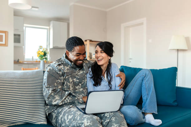istock Army Man With His Wife Using Laptop 1182744224