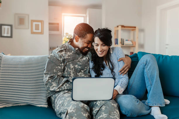 istock Army Man With His Wife Using Laptop 1182744273