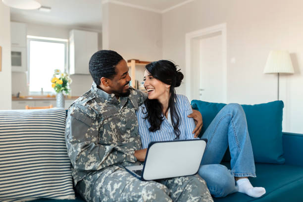 istock Army Man With His Wife Using Laptop 1182744279