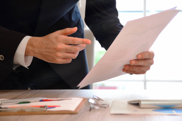 istock A businessman analyzing business graphs on the office desk 1182744558