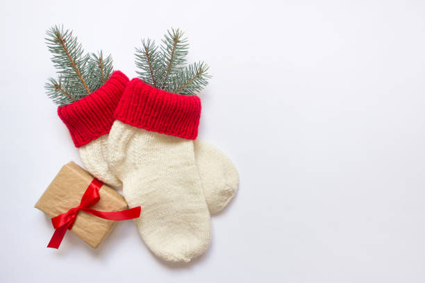 istock Christmas socks with a present tied with red bow 1182745101