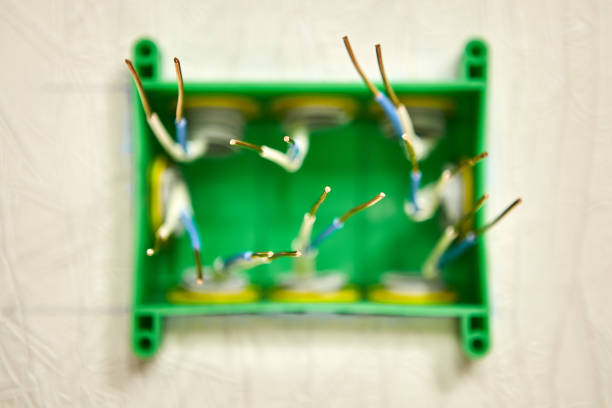 istock Bare copper wires in a junction box. 1182745217