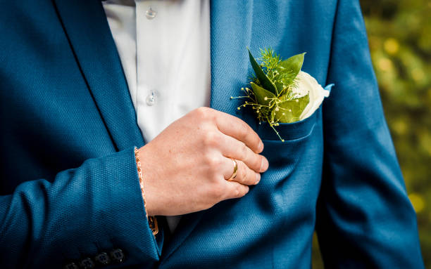 istock Boutonniere fresh greens, men's hand with a ring 1182745666