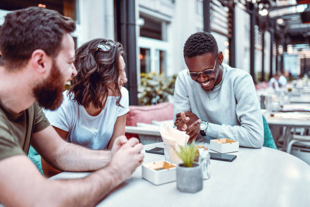 istock Friends Exchanging Their Different Cultural Traits And Having A Few Laughs 1182745750
