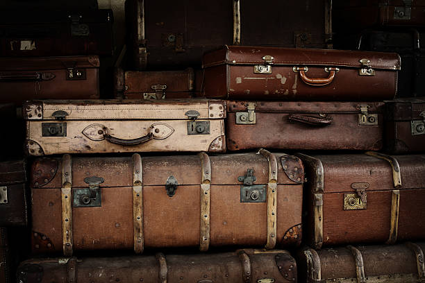 istock Stack of old suitcases at railway station 118274617