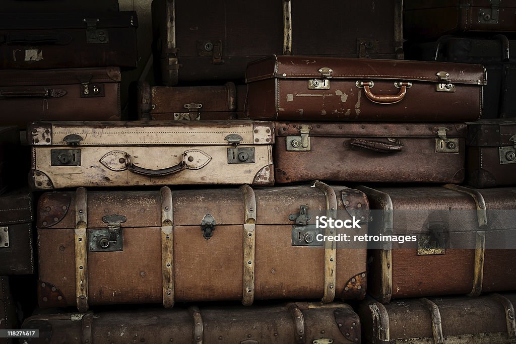 Stack of old suitcases at railway station  Antique Stock Photo