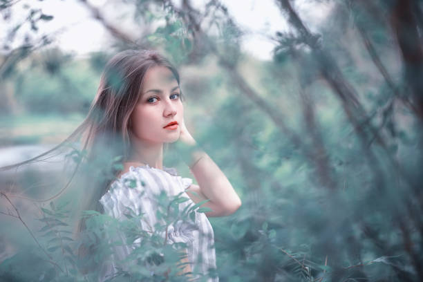 A girl in a spring green park on a walk