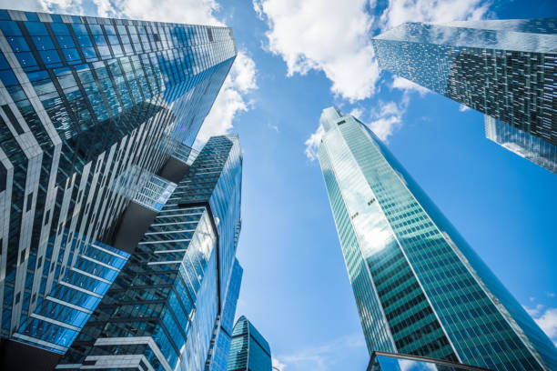 istock Business background. Modern office buildings under blue sky. 1182749273
