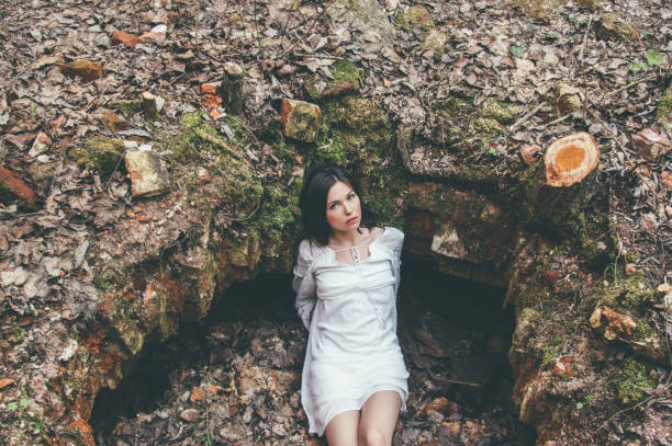 istock Beautiful brunette girl posing on earth 1182751185