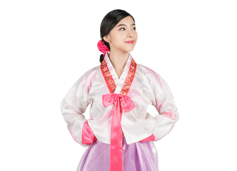 Portrait of young attractive Korean Woman with Hanbok, the traditional Korean dress smiling with white background with clipping path feeling confident and positive.
