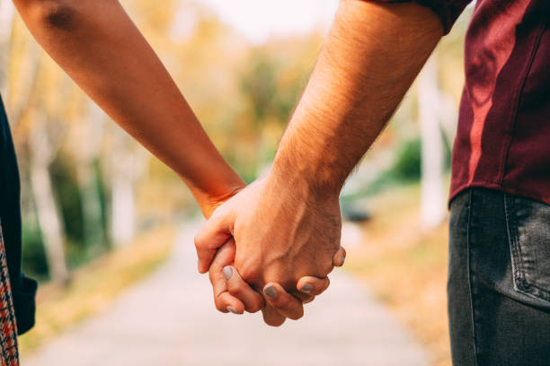 istock Young Couple Holding Hands 1182758663