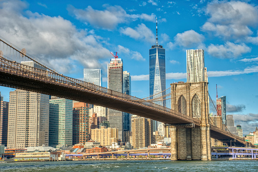 Downtown Manhattan with the Brooklyn Bridge and World Trade Center as Seen from DUMBO Brooklyn New York City.