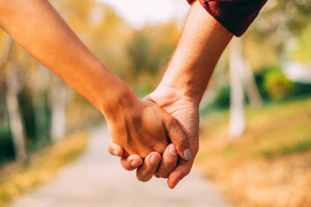istock Young Couple Holding Hands 1182759770