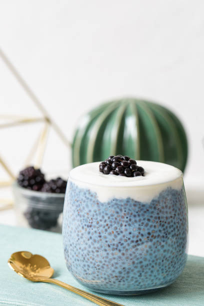 istock Blue chia seed pudding with blackberries in a glass 1182762015