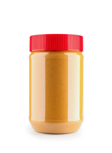close-up de maquete de garrafa de manteiga de amendoim isolado em fundo branco, arquivo contém um caminho de recorte. - peanut butter - fotografias e filmes do acervo
