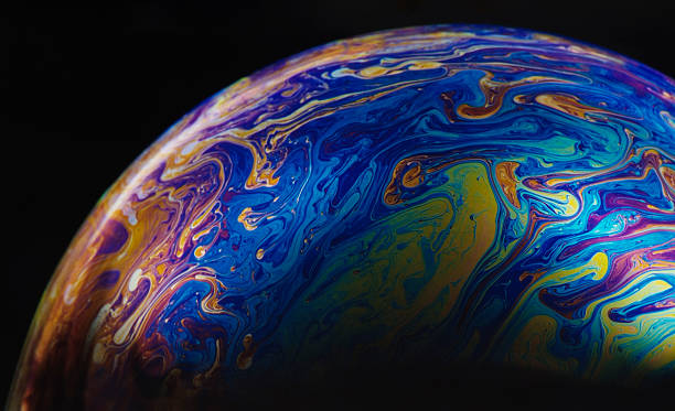 istock Isolated shot of multicolored soap bubble against black background 118277149