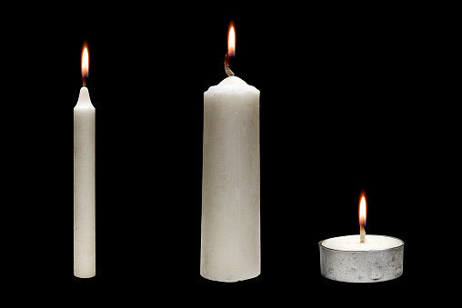 The row of candle variation for Halloween over black background