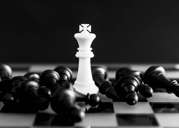 istock White king standing on the chess board 1182777446