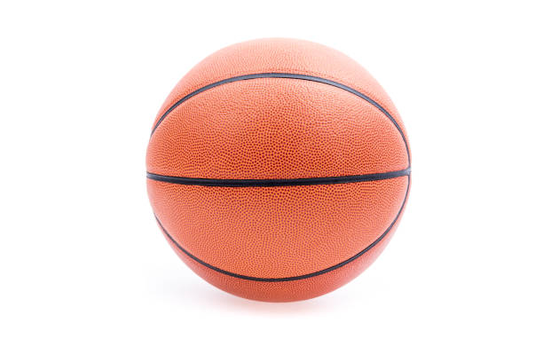 Indoor leather basketball on a traditional hardwood court. Selective focus. Makes a great background for an announcement.
