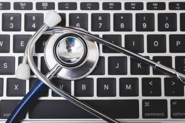 istock Health stethoscope on keyboard of laptop computer 1182778466