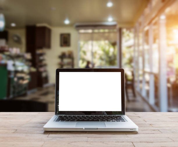 istock Laptop on wood table 1182778604