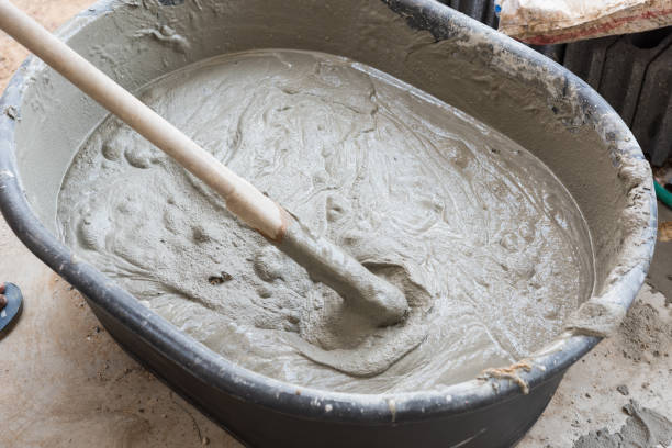 istock cement mix concrete is compacted sand by spade 1182778772