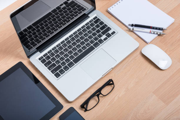istock Top view open laptop with digital tablet and white smartphone 1182779078
